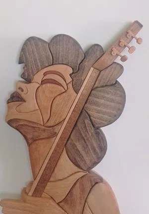Wooden Guitar Player Wall Art
