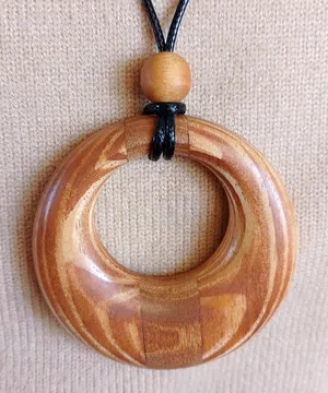 Handcrafted Wooden Pendants – Asymmetry in a Circle